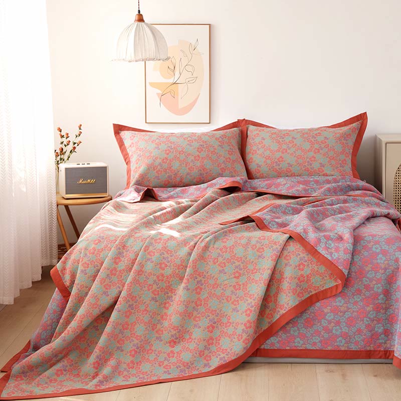 Couette réversible en gaze de coton à motif floral et jacquard