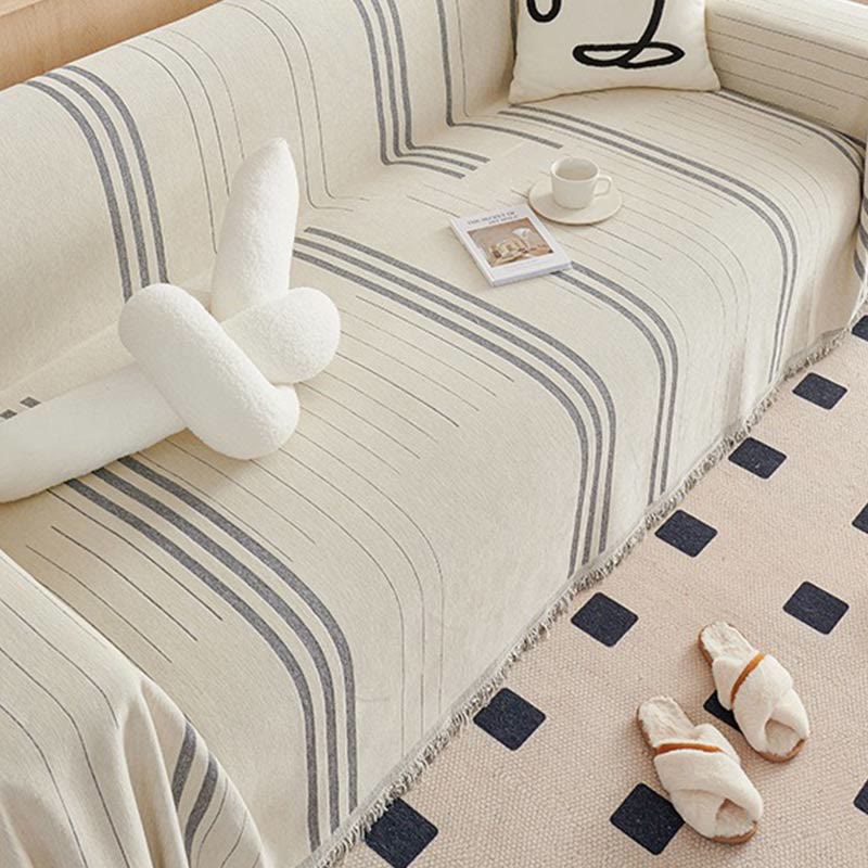 Housse de canapé en chenille à rayures droites et pompons