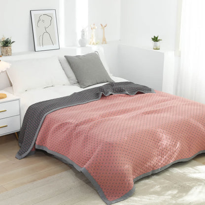 Couverture douce et réversible en pur coton avec un motif quadrillé