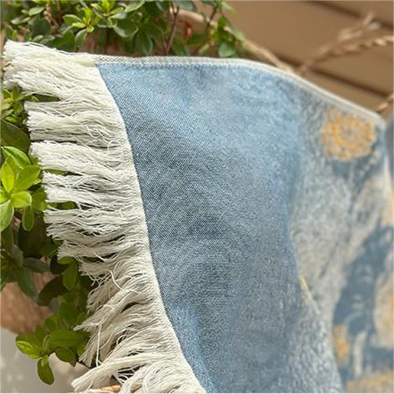 Serviette respirante en pur coton avec pompons