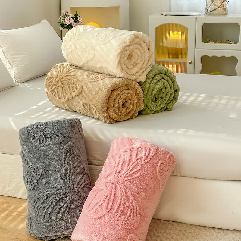 Couverture polaire réversible avec des papillons de couleur unie
