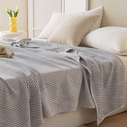 Couette douce en pur coton avec un motif de losange neutre