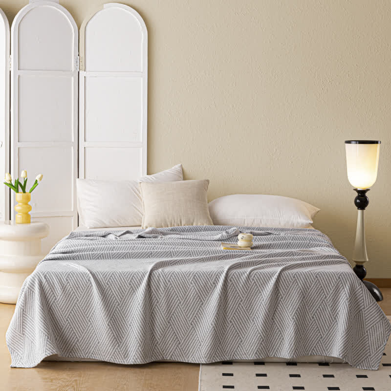 Couette douce en pur coton avec un motif de losange neutre
