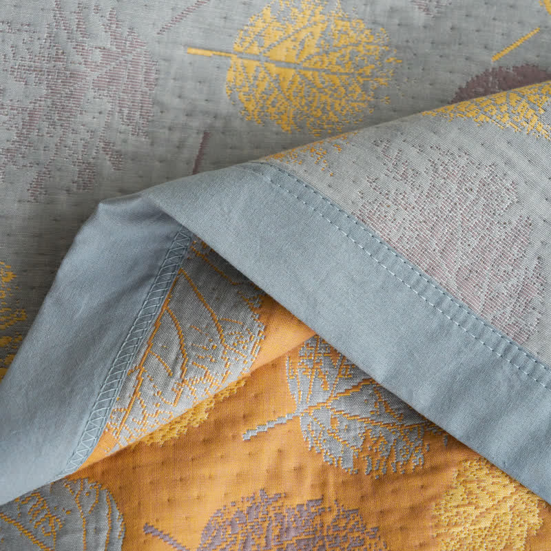 Couette réversible en gaze de coton jacquard à motifs de feuilles