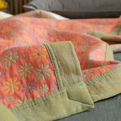 Couette réversible en coton avec motif de marguerites colorées
