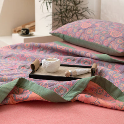 Couette réversible en gaze de coton à motif jacquard floral