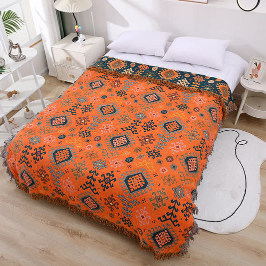 Couette rétro géométrique en gaze de coton avec pompons