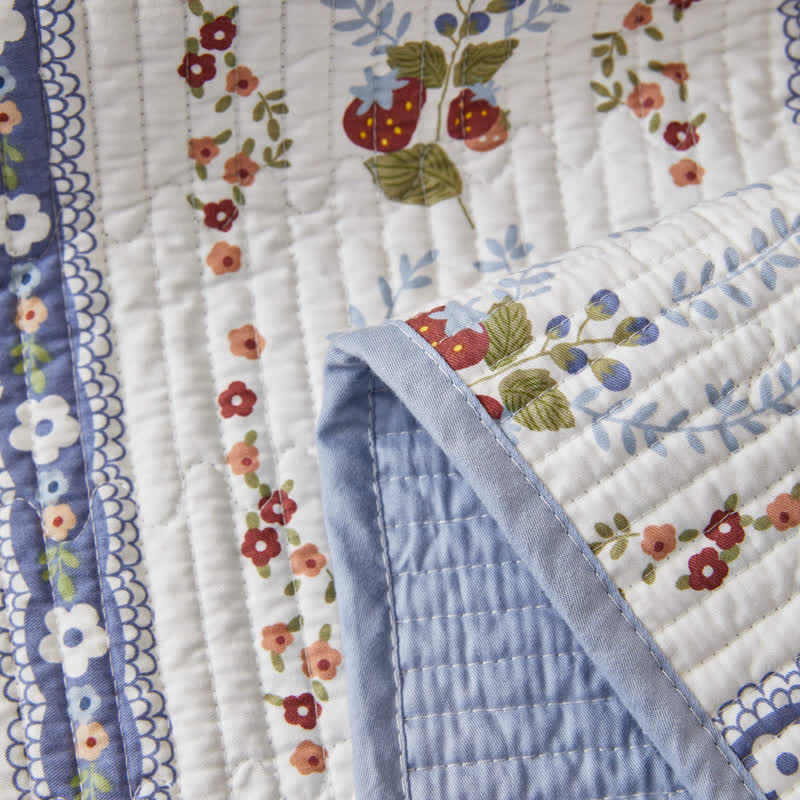 Linge de lit matelassé en pur coton avec un motif floral frais