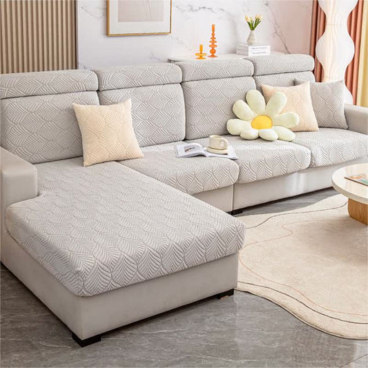 Housse de canapé jacquard unie avec structure en feuilles