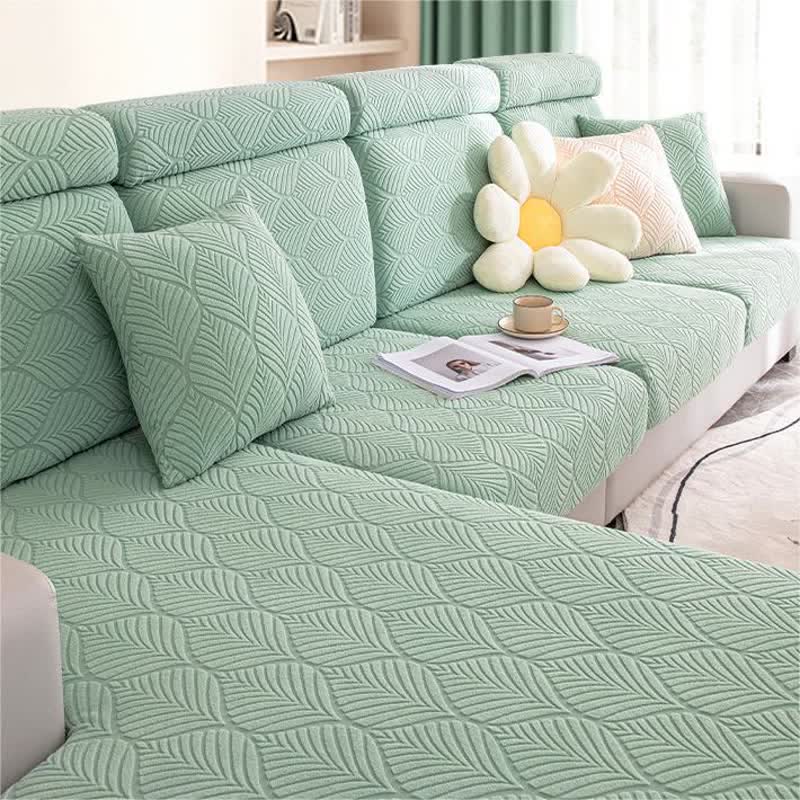 Housse de canapé jacquard unie avec structure en feuilles