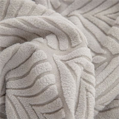 Housse de canapé jacquard unie avec structure en feuilles