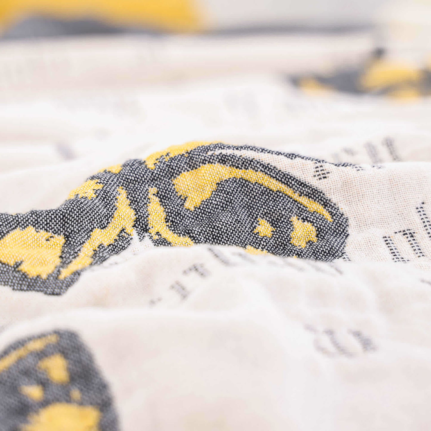Couette jacquard en gaze de coton avec pompons papillons