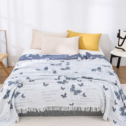 Couette jacquard en gaze de coton avec pompons papillons
