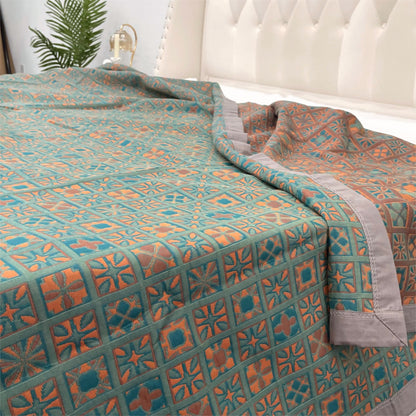 Couette réversible en pur coton à carreaux et motif floral