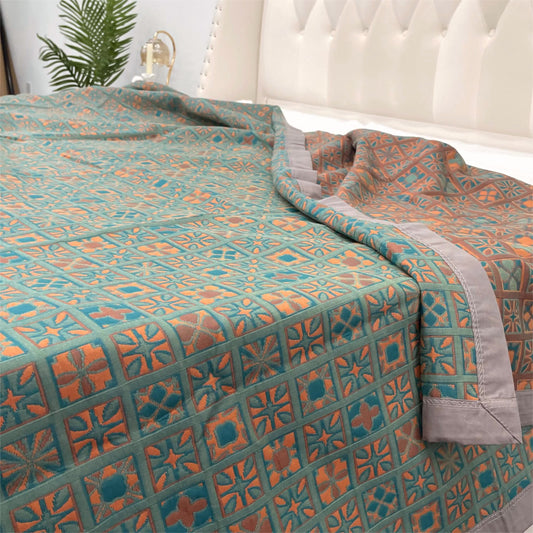 Couette réversible en pur coton à carreaux et motif floral
