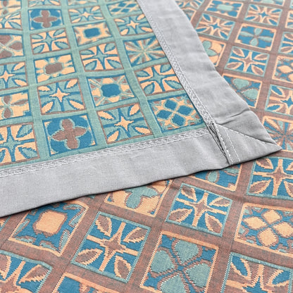 Couette réversible en pur coton à carreaux et motif floral