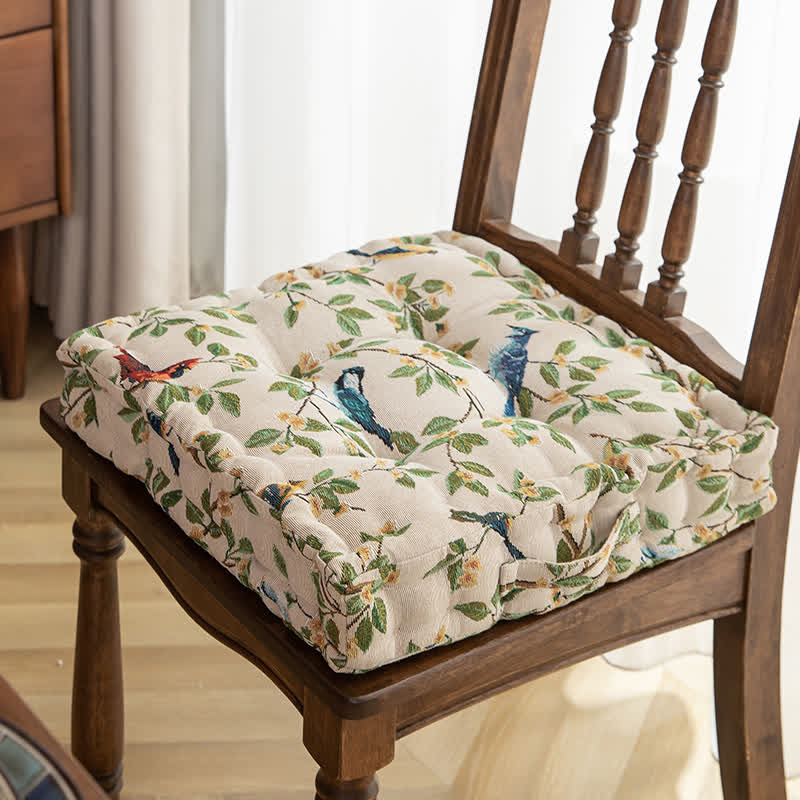 Coussin de chaise et de sol en jacquard motif feuilles d'oiseaux