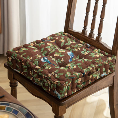 Coussin de chaise et de sol en jacquard motif feuilles d'oiseaux