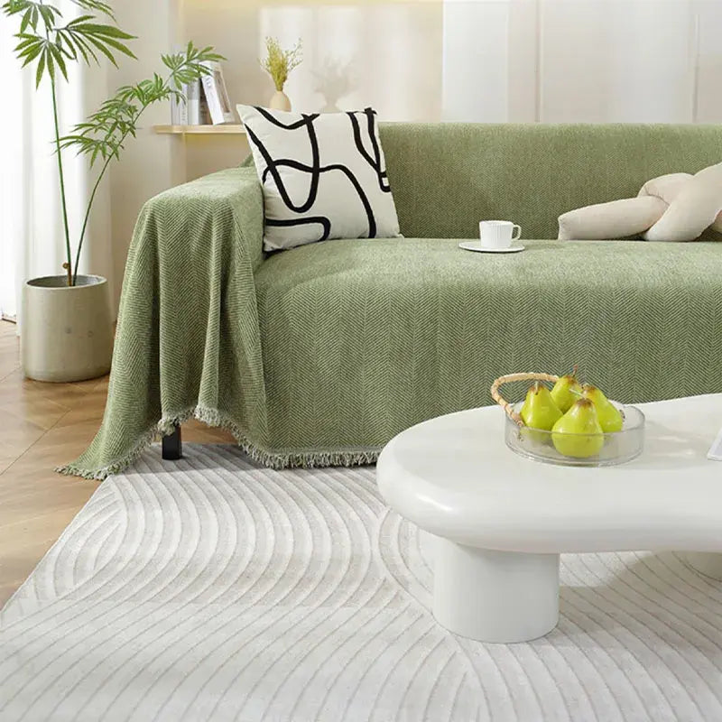 Housse de canapé en chenille avec motif à chevrons et pompons