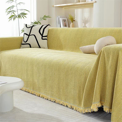 Housse de canapé en chenille avec motif à chevrons et pompons