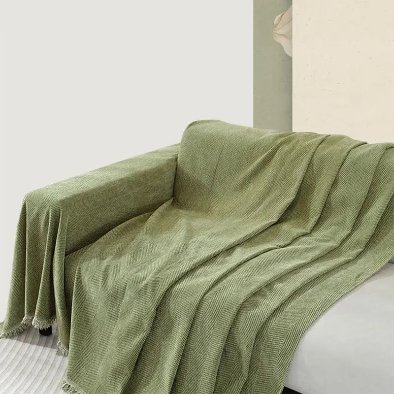 Housse de canapé en chenille avec motif à chevrons et pompons