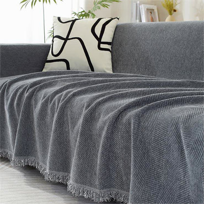 Housse de canapé en chenille avec motif à chevrons et pompons
