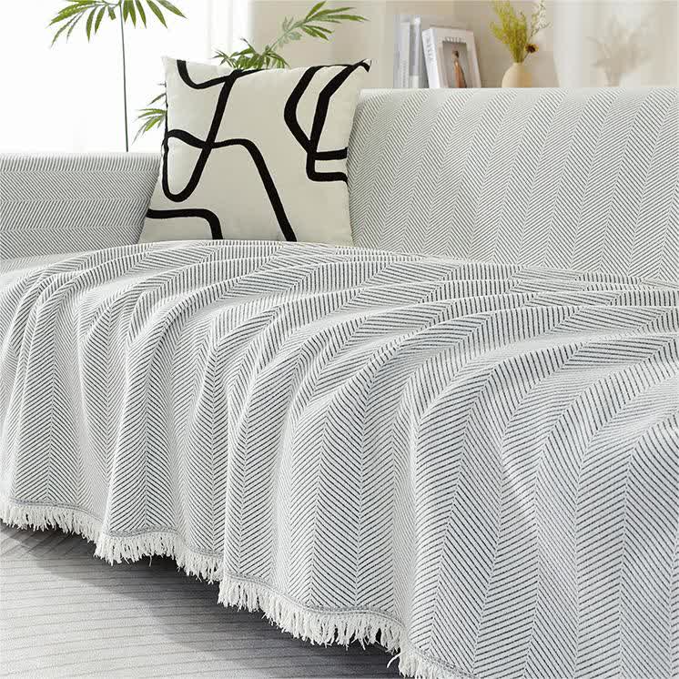 Housse de canapé en chenille avec motif à chevrons et pompons