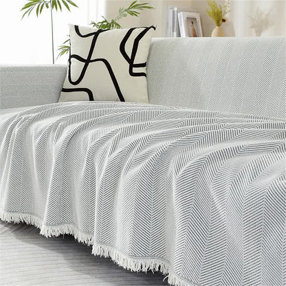 Housse de canapé en chenille avec motif à chevrons et pompons