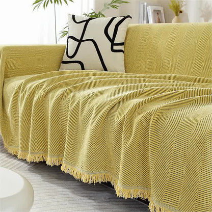 Housse de canapé en chenille avec motif à chevrons et pompons