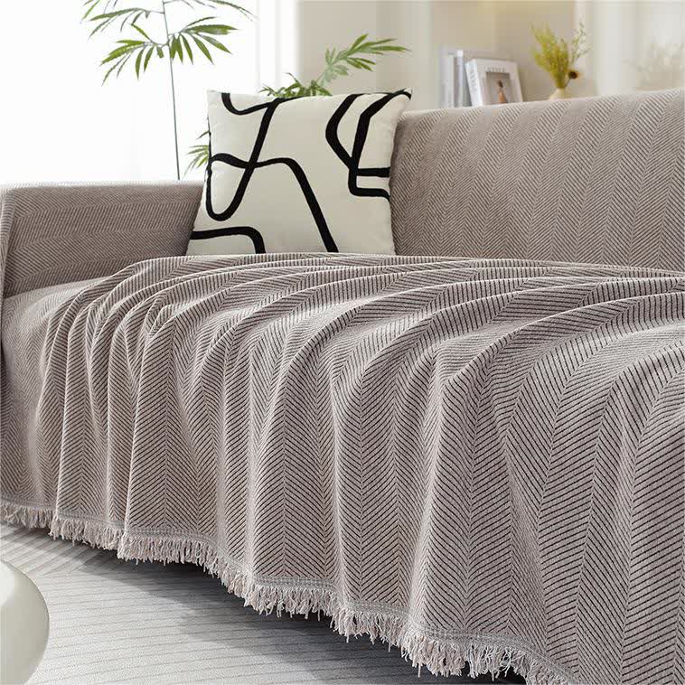 Housse de canapé en chenille avec motif à chevrons et pompons