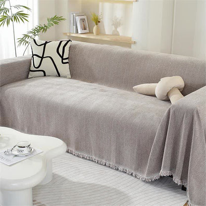 Housse de canapé en chenille avec motif à chevrons et pompons