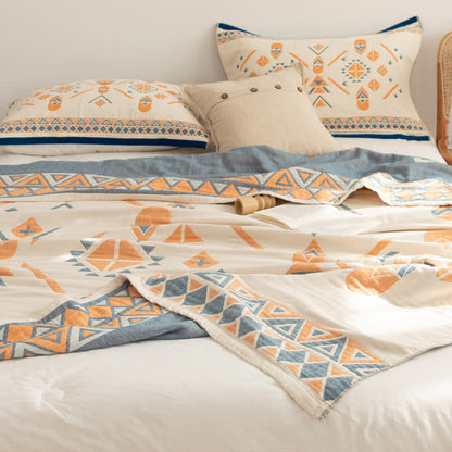 Couette réversible en gaze de coton de style bohème à motif géométrique