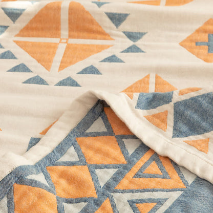 Couette réversible en gaze de coton de style bohème à motif géométrique