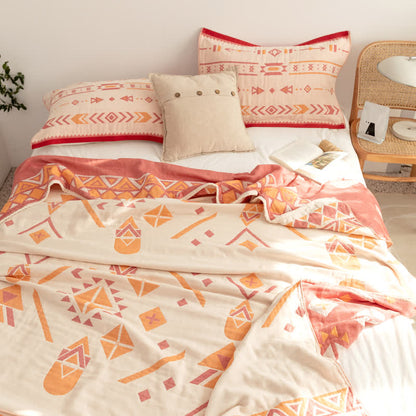 Couette réversible en gaze de coton de style bohème à motif géométrique
