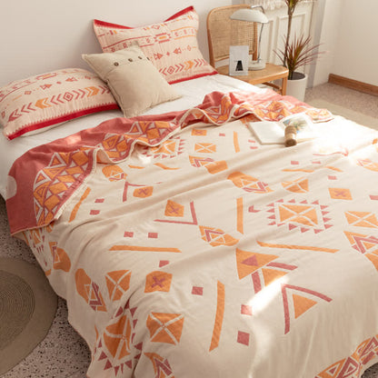 Couette réversible en gaze de coton de style bohème à motif géométrique