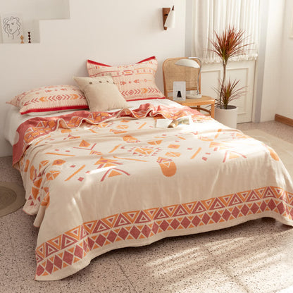 Couette réversible en gaze de coton de style bohème à motif géométrique