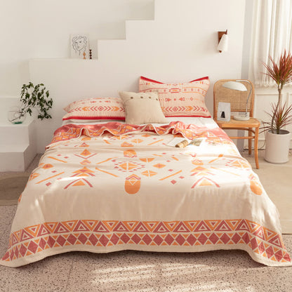 Couette réversible en gaze de coton de style bohème à motif géométrique