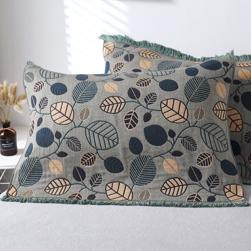 Serviette oreiller en gaze de coton avec pompons et feuilles (2 pièces)