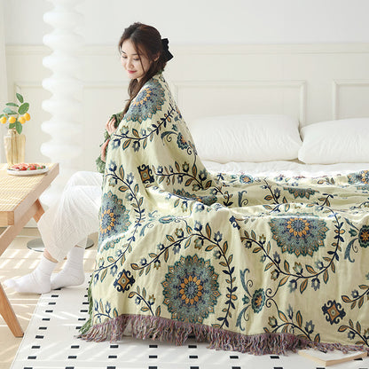 Couette réversible à motif floral et pompons en gaze de coton