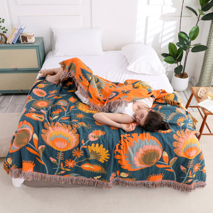 Couette en gaze de coton respirante avec pompons et motif floral