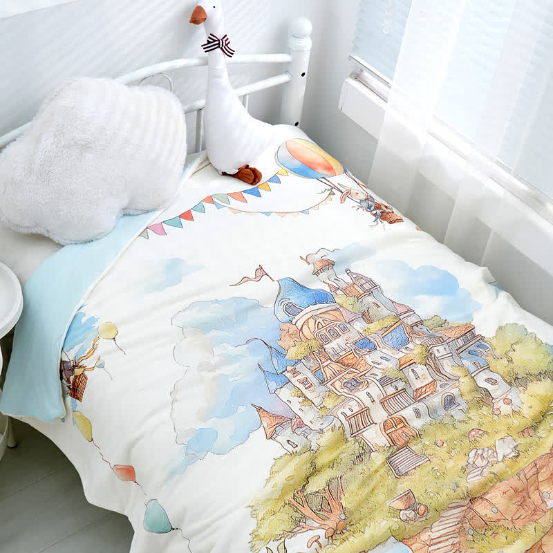 Couverture bébé en coton avec un château de style Pays des Merveilles