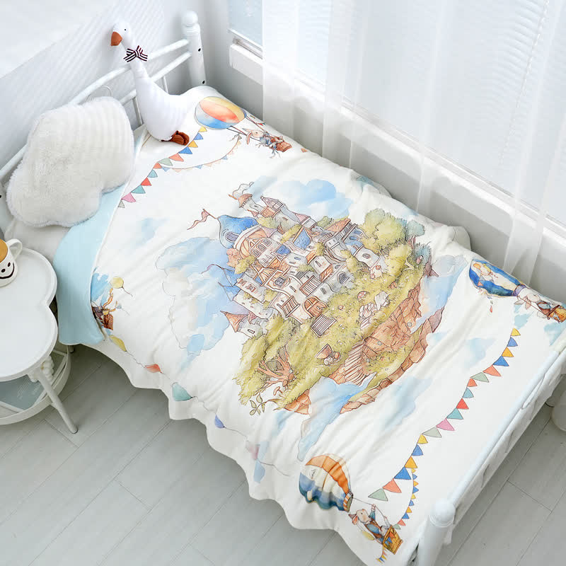 Couverture bébé en coton avec un château de style Pays des Merveilles