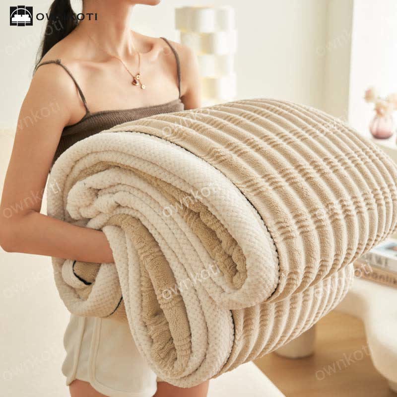 Couverture polaire avec structure ondulée jacquard
