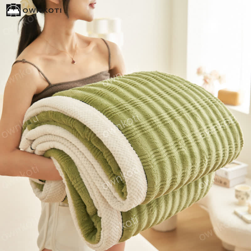 Couverture polaire avec structure ondulée jacquard