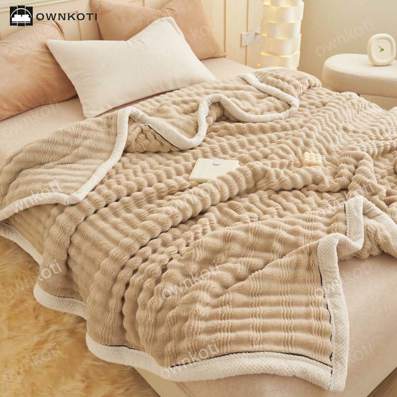 Couverture polaire avec structure ondulée jacquard