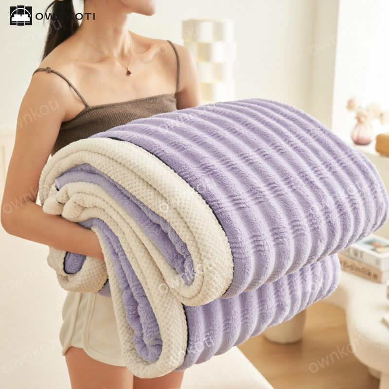 Couverture polaire avec structure ondulée jacquard