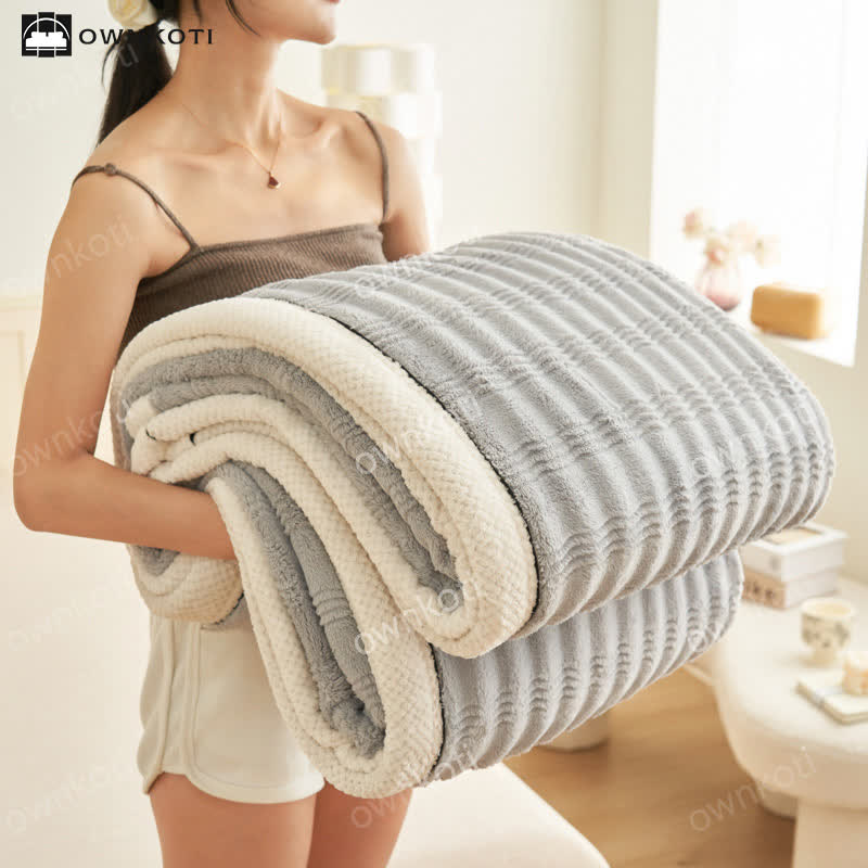 Couverture polaire avec structure ondulée jacquard