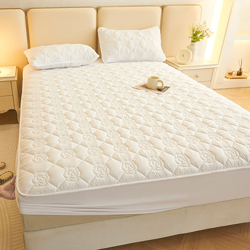Drap-housse matelassé uni à motif floral