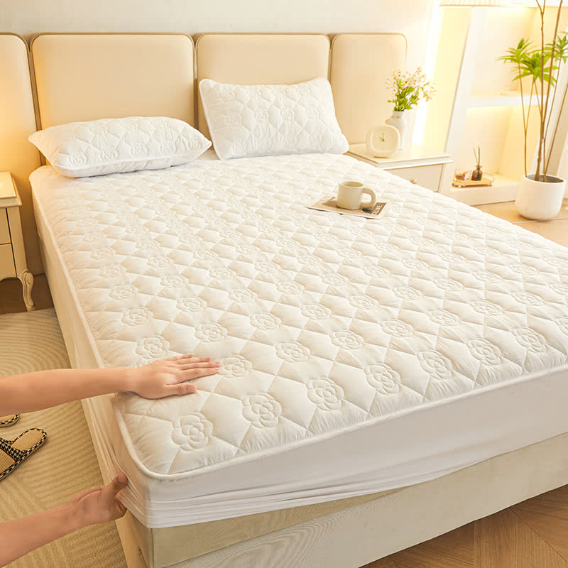 Drap-housse matelassé uni à motif floral