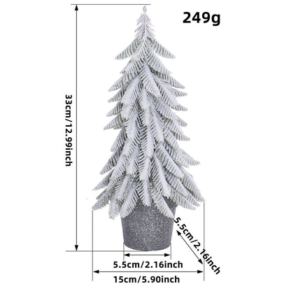 Sapin de Noël enneigé comme décoration en pot pour la maison